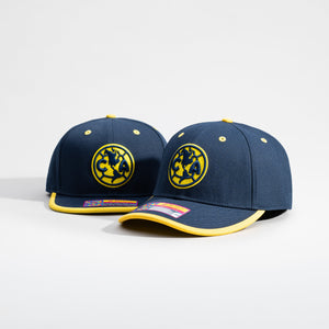 Club America Tape Snapback and Adjustable hats on a grey background.