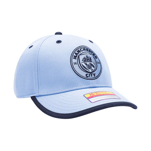 Manchester City Tape Adjustable with high crown, curved peak brim, and adjustable buckle strap closure, in Light Blue